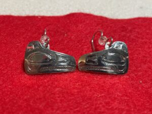 A pair of Raven earrings completed all engraved and carved basically the same way you would carve wood